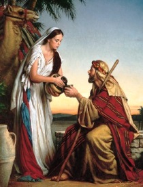A picture of Abraham's servant being given a drink.